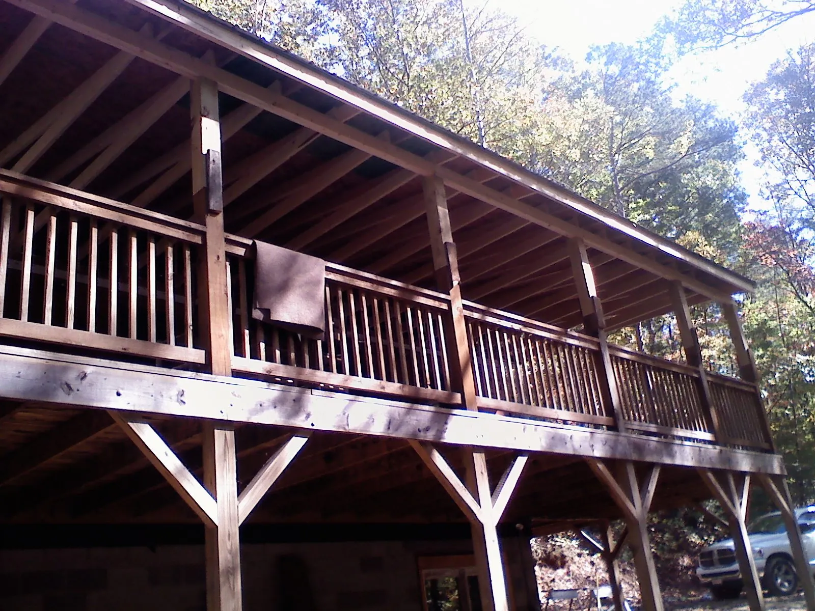 Timber framing under a new elevated porch and deck — Roof Leak Repair in Madbury by Roofing Brothers